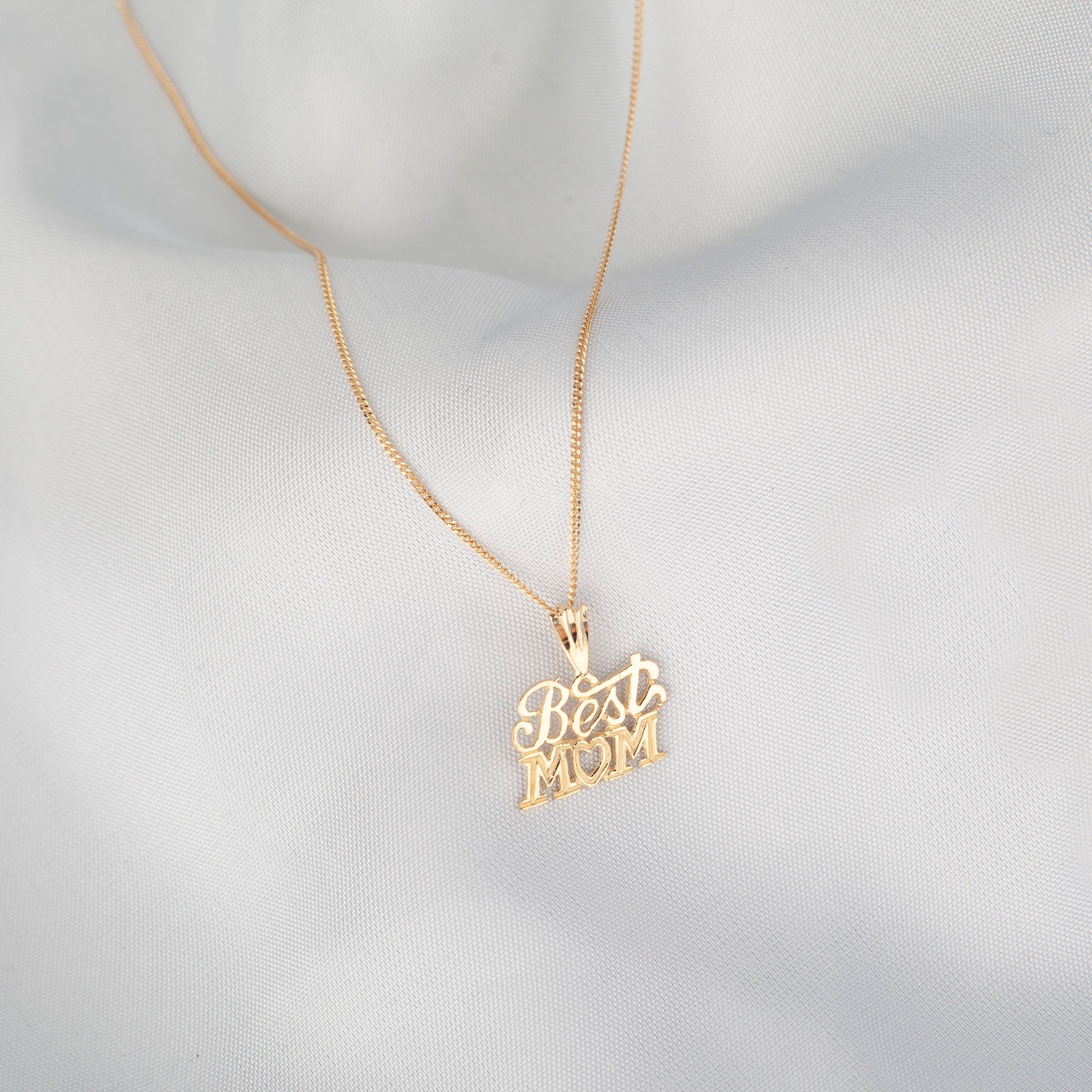 "Best Mom" Pendant in 10K gold with a thin curb chain or figaro chain