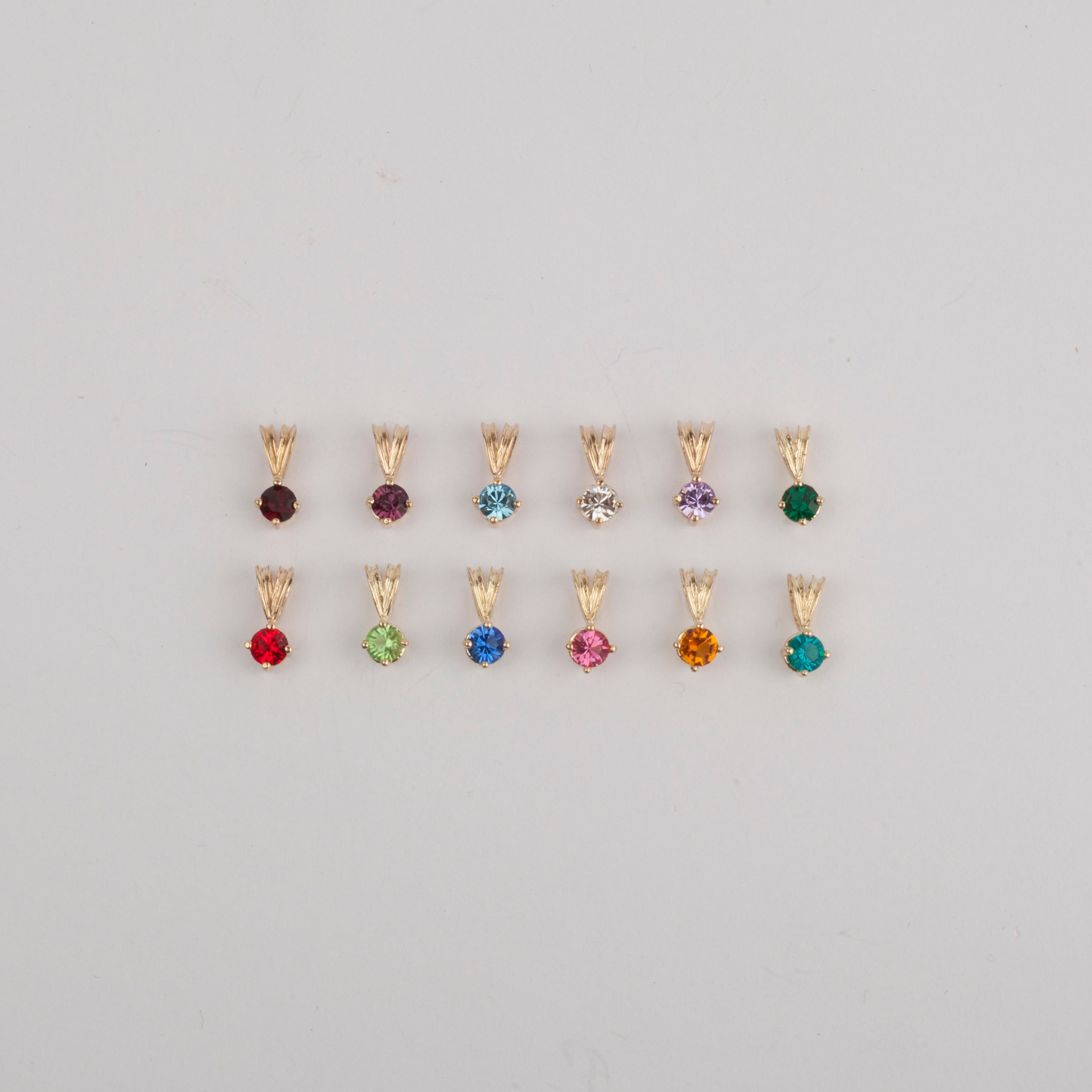 4mm Coloured CZ Stone on a 10K Yellow Gold Setting