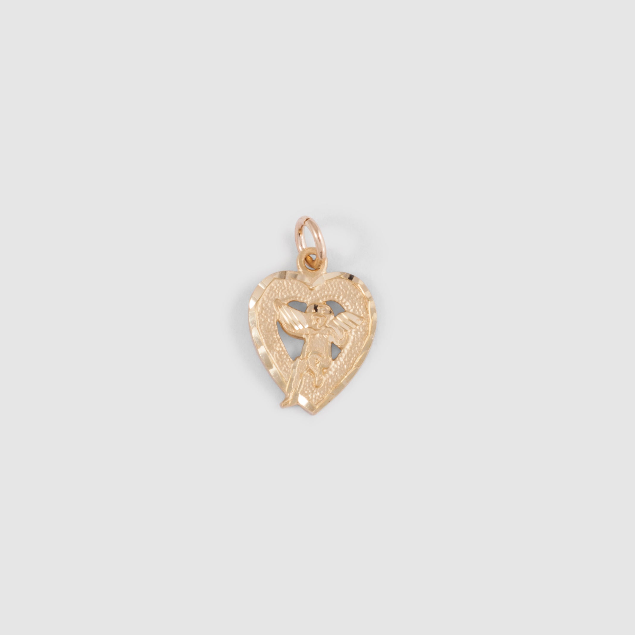 Cherub Angel sitting in a heart-shaped pendant