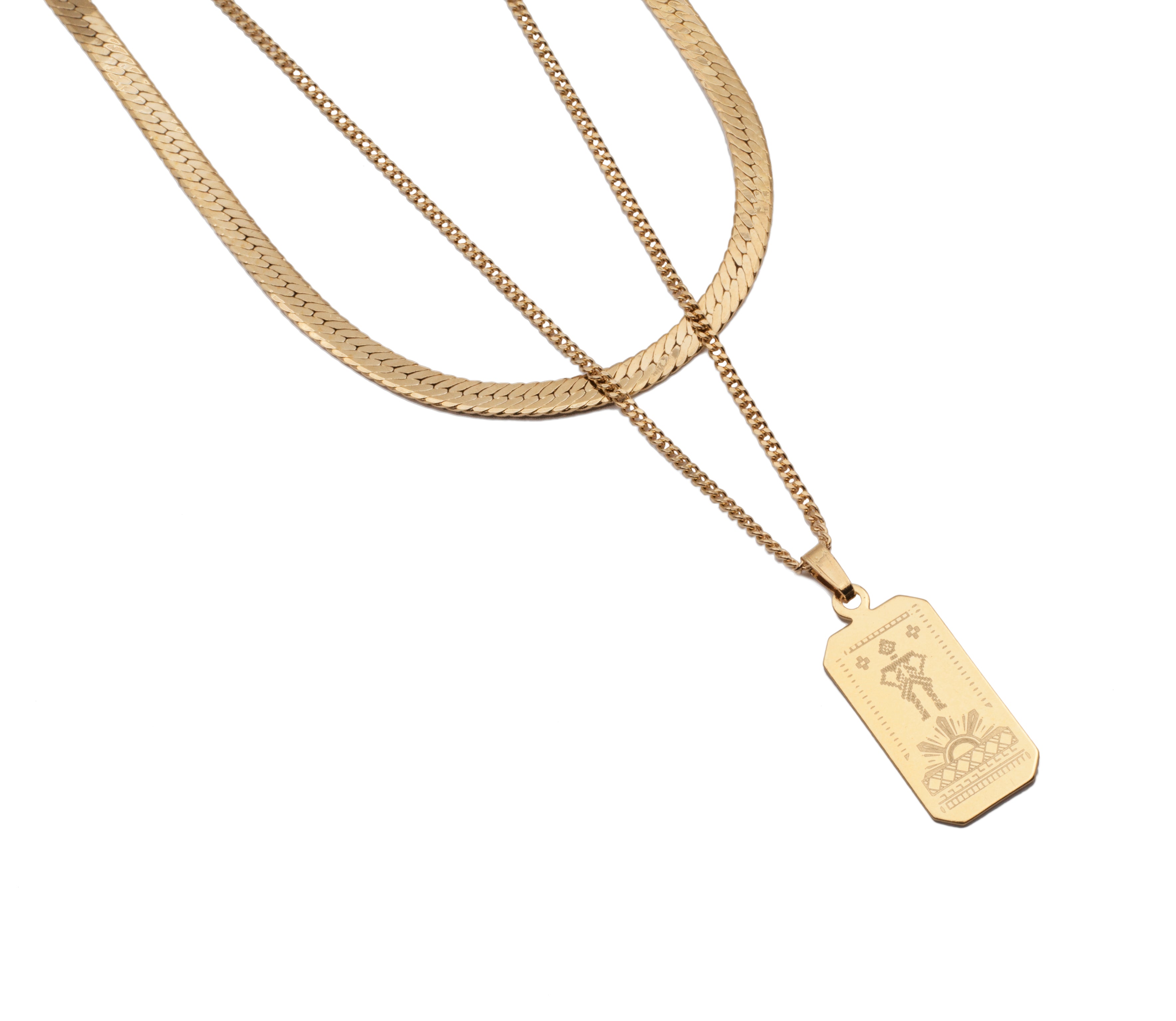 Gold flat snake chain and curb chain with dog tag pendant featuring detailed engraving