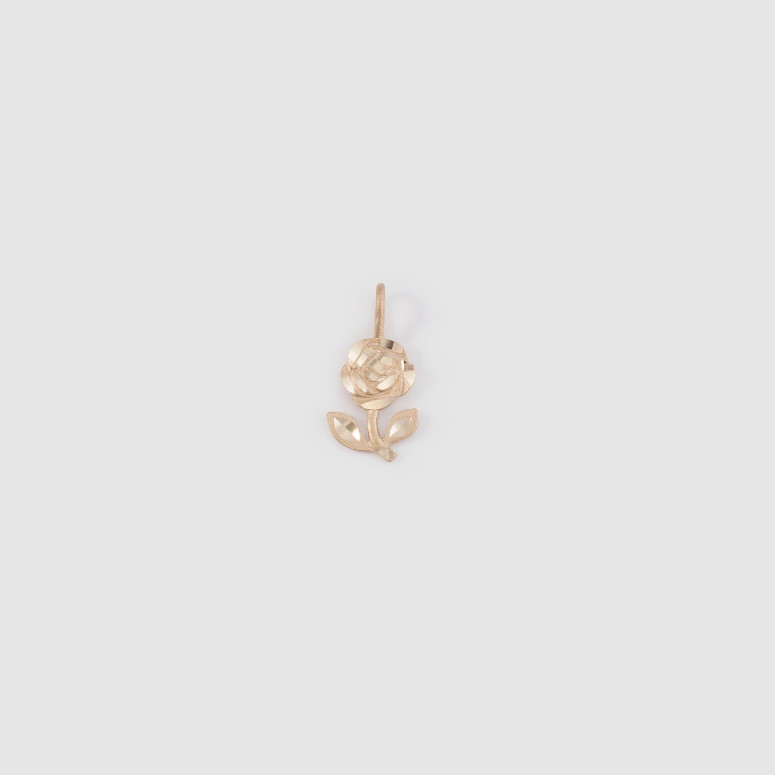 10k yellow gold flower pendant with diamond cut details