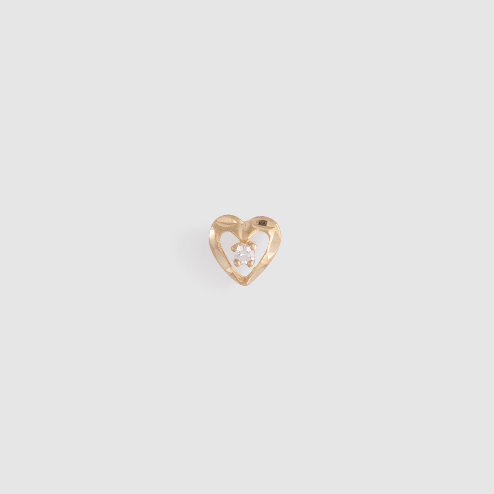 Gold heart-shaped studs with cz stone