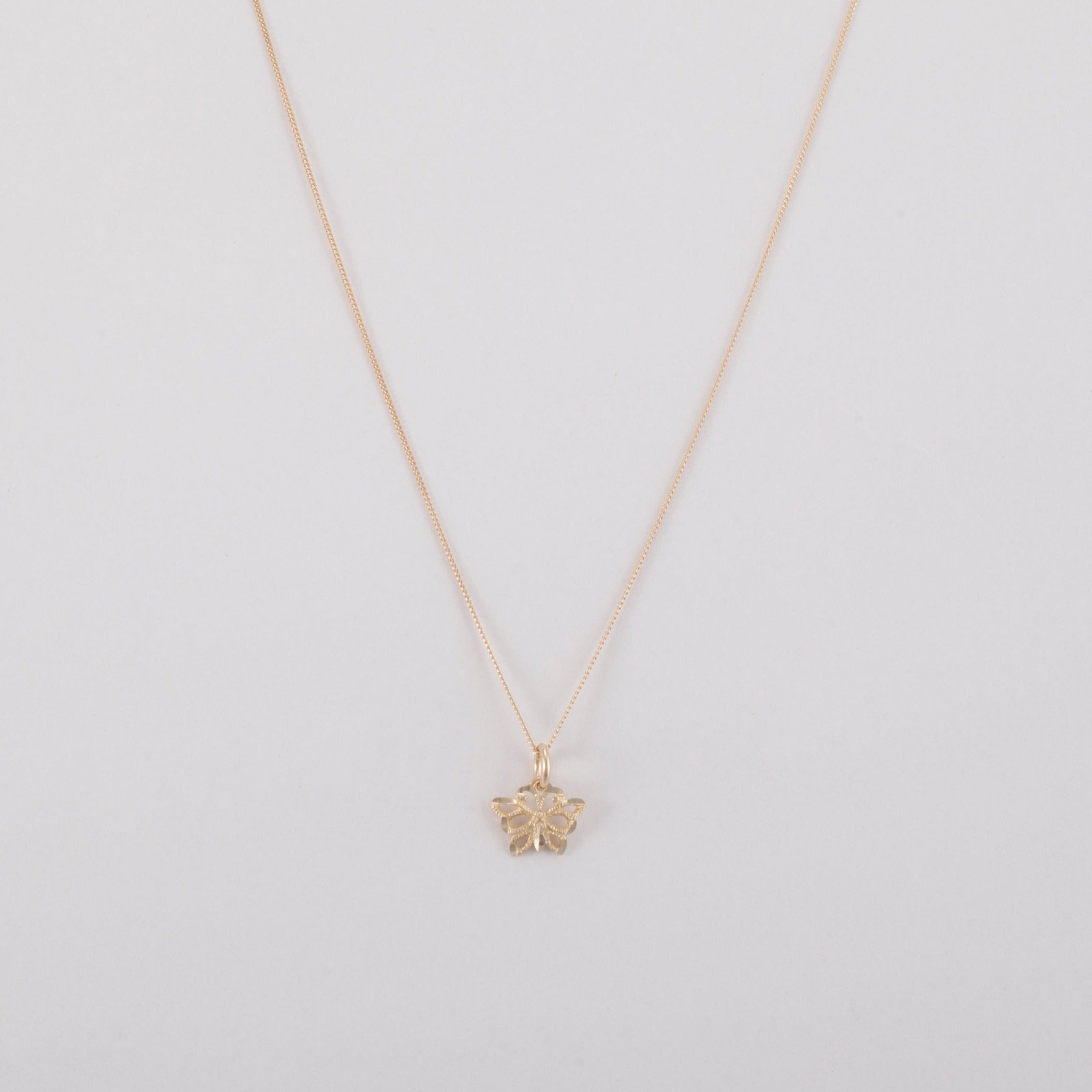 Intricate diamond cut Butterfly Pendant on a thin curb chain