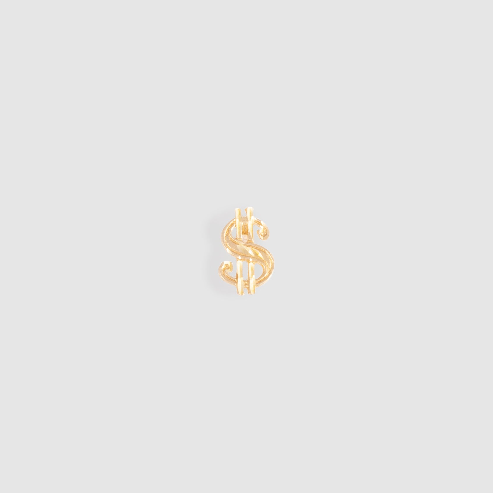 Dollar Sign Stud Earring. Made of 10k Yellow Gold. Stud measures 11mm x 7mm x 1mm