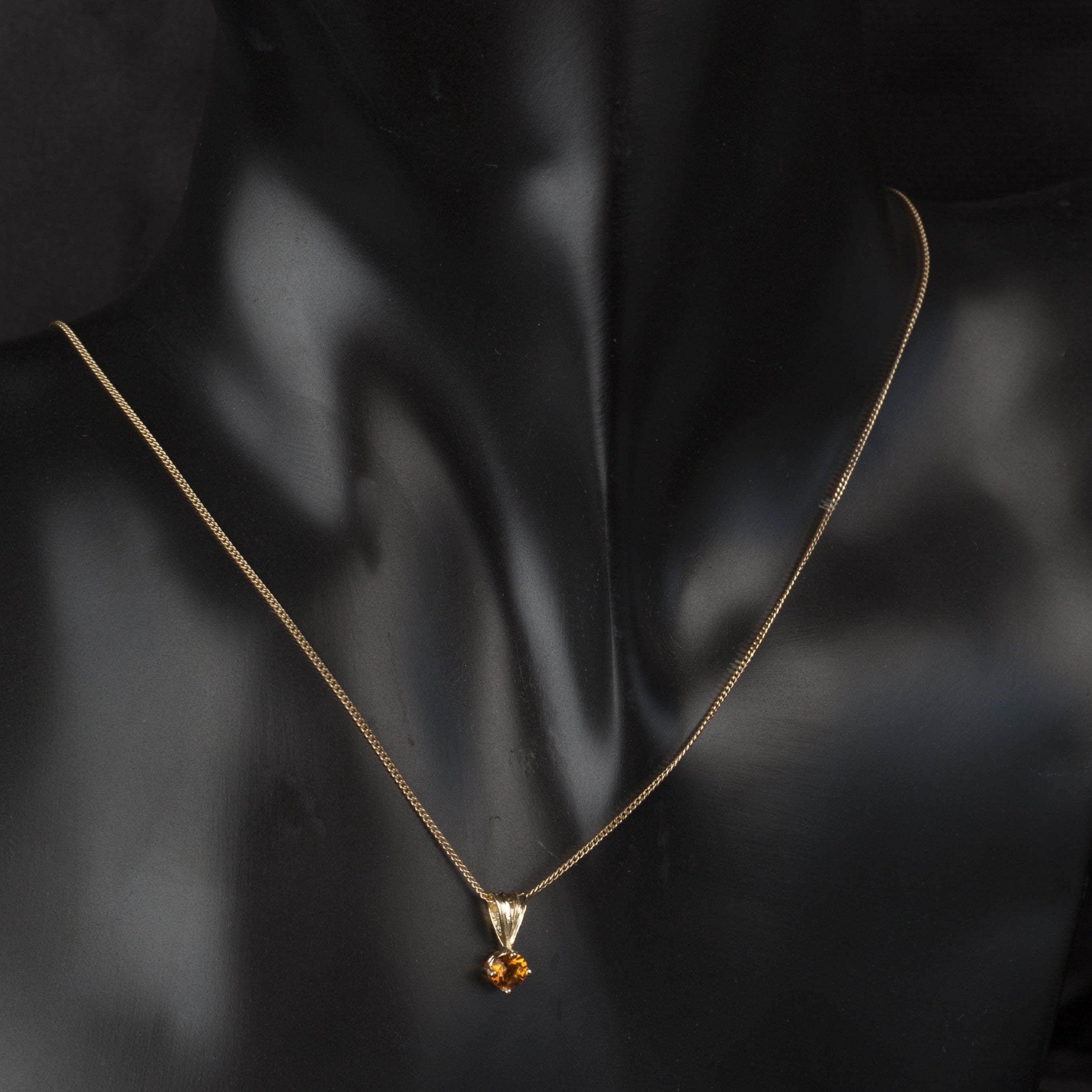 birthstone pendant on a thin curb chain