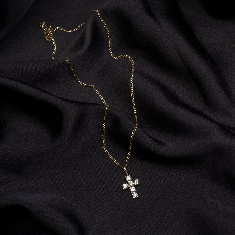 gold cross pendant with CZ stones on a figaro chain