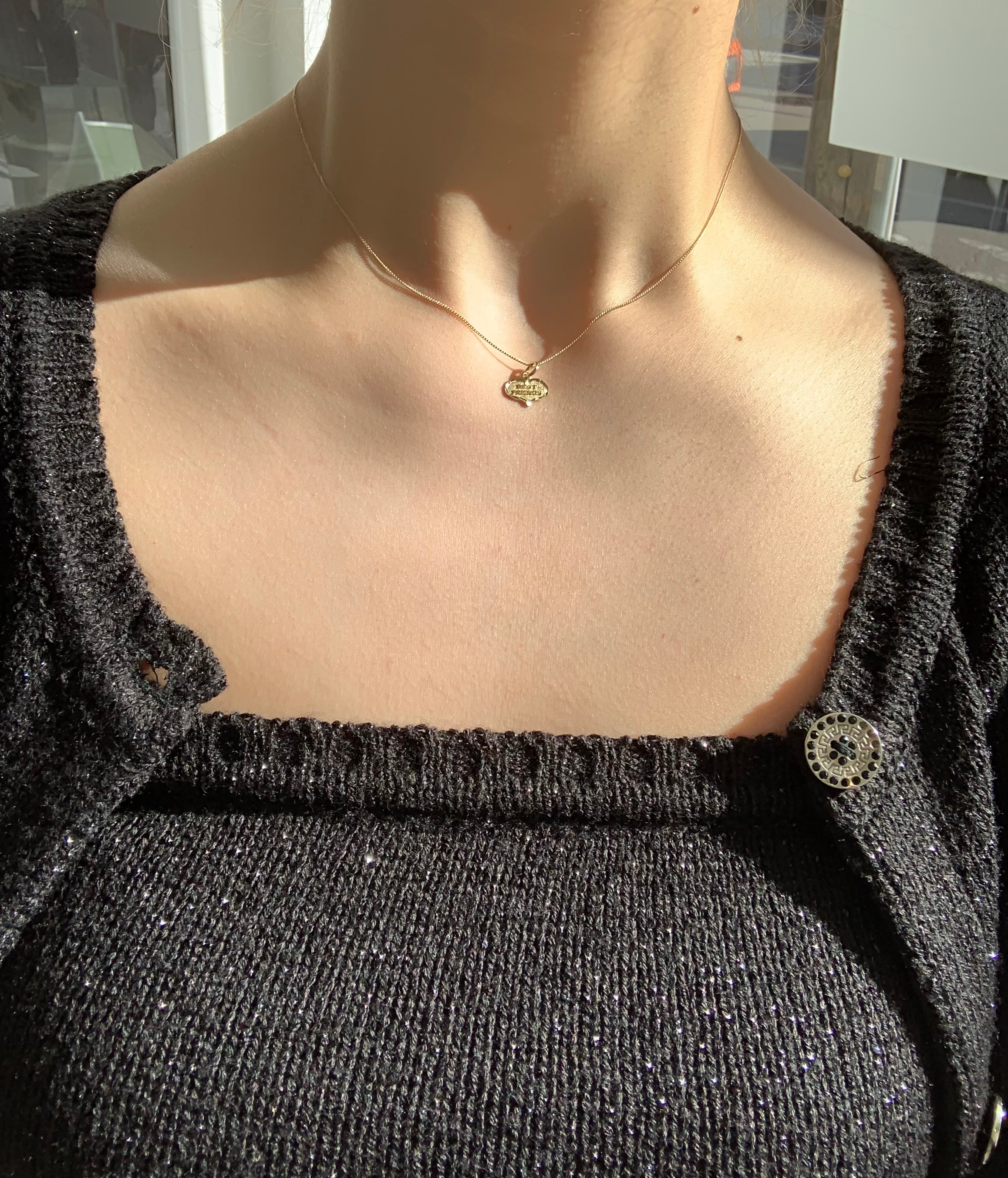 Best Friends' heart charm made with 10K Solid Yellow Gold on figure with an 18 inch 10k gold curb chain