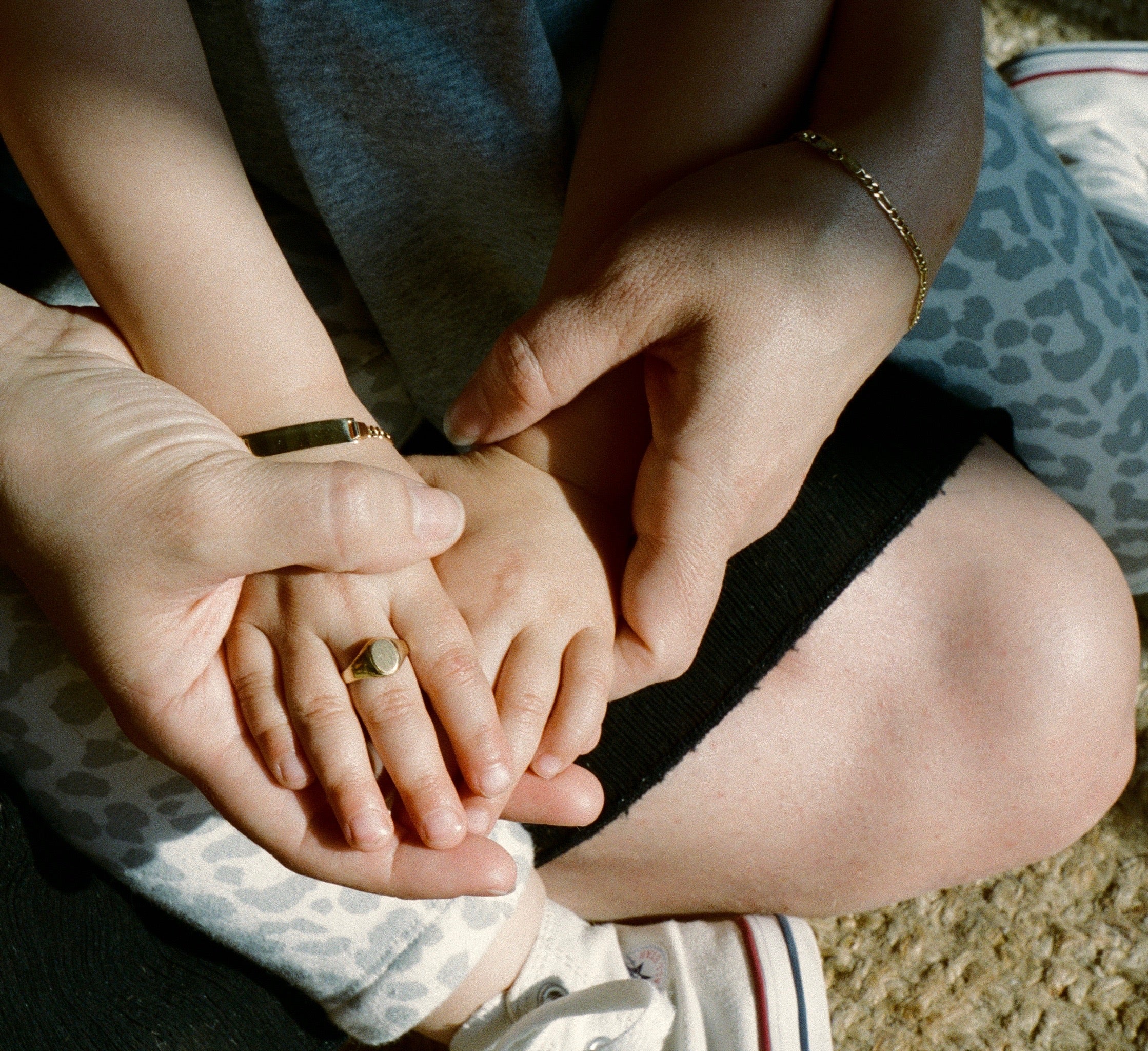 baby wearing 10K yellow gold oval signet ring