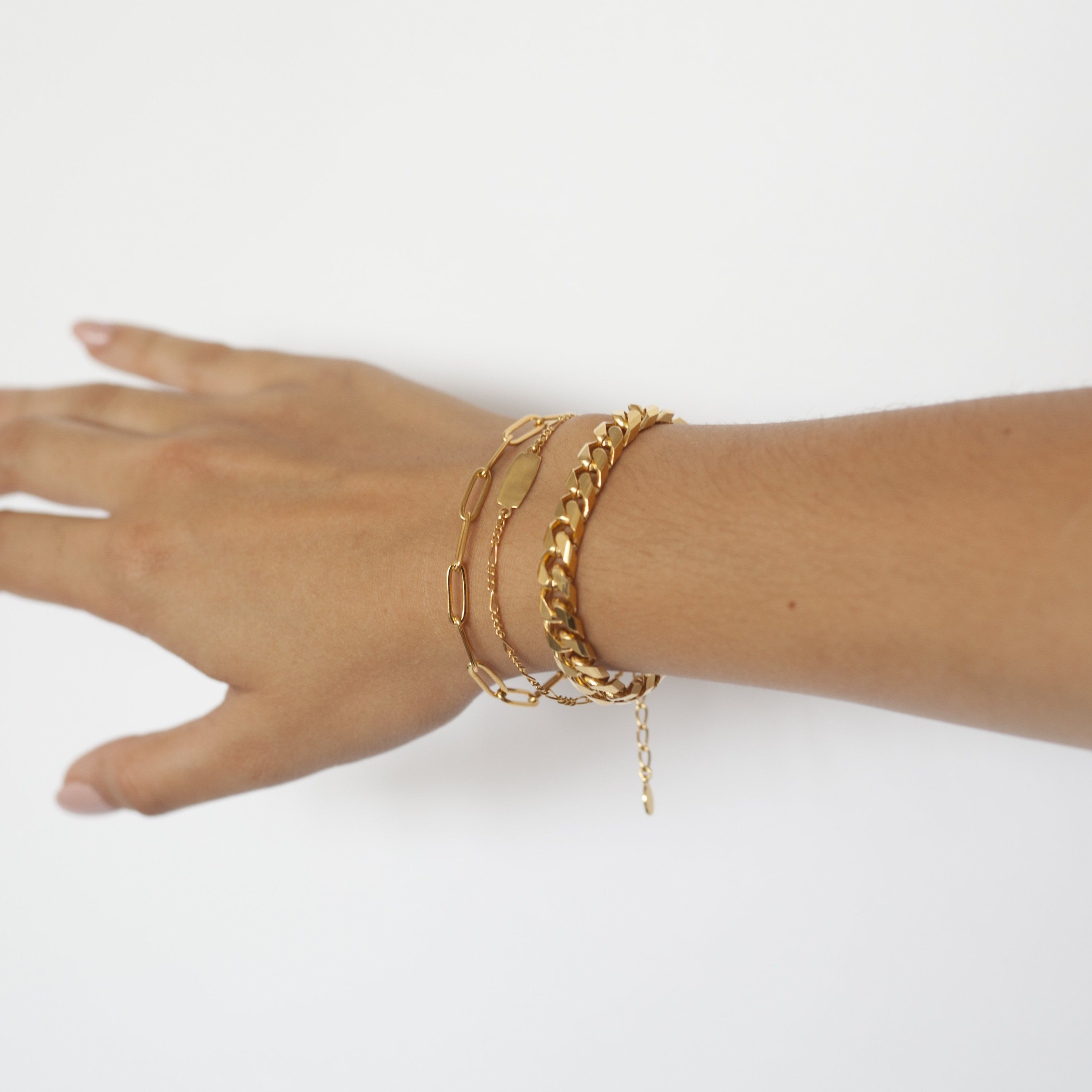 model wearing gold cuban link bracelet