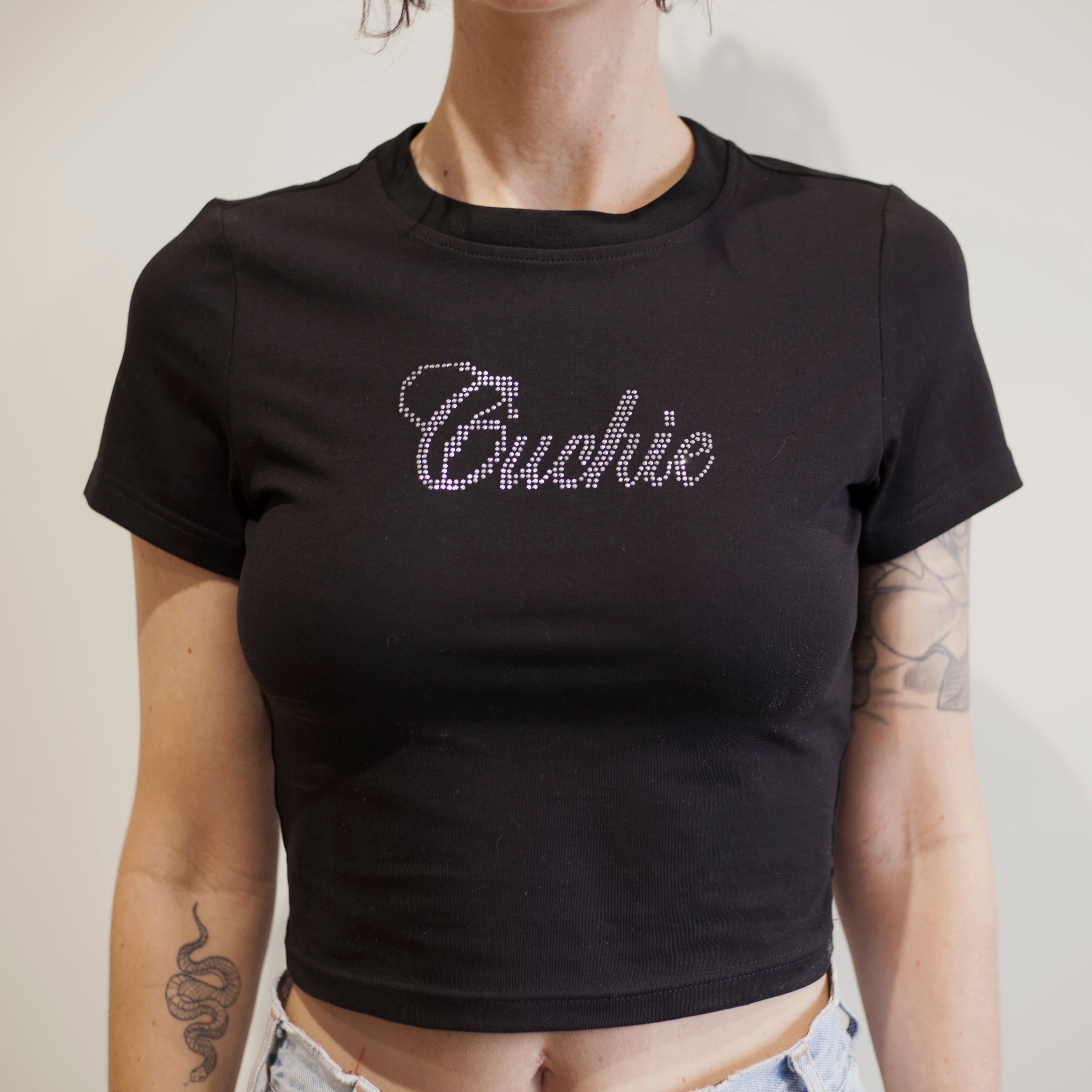 Black cropped t-shirt with "Cuchie" text in rhinestones on model