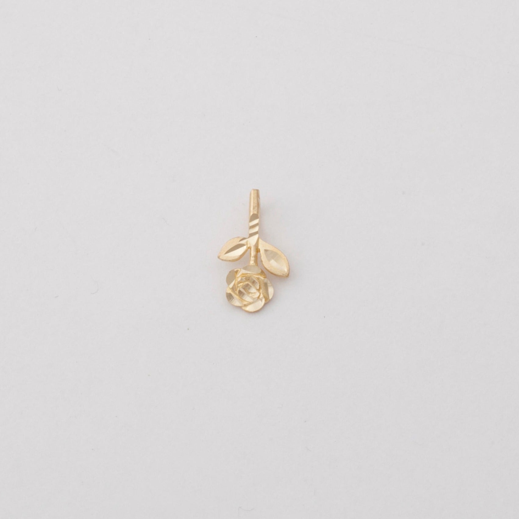 10k gold upside down flower pendant with diamond cut details