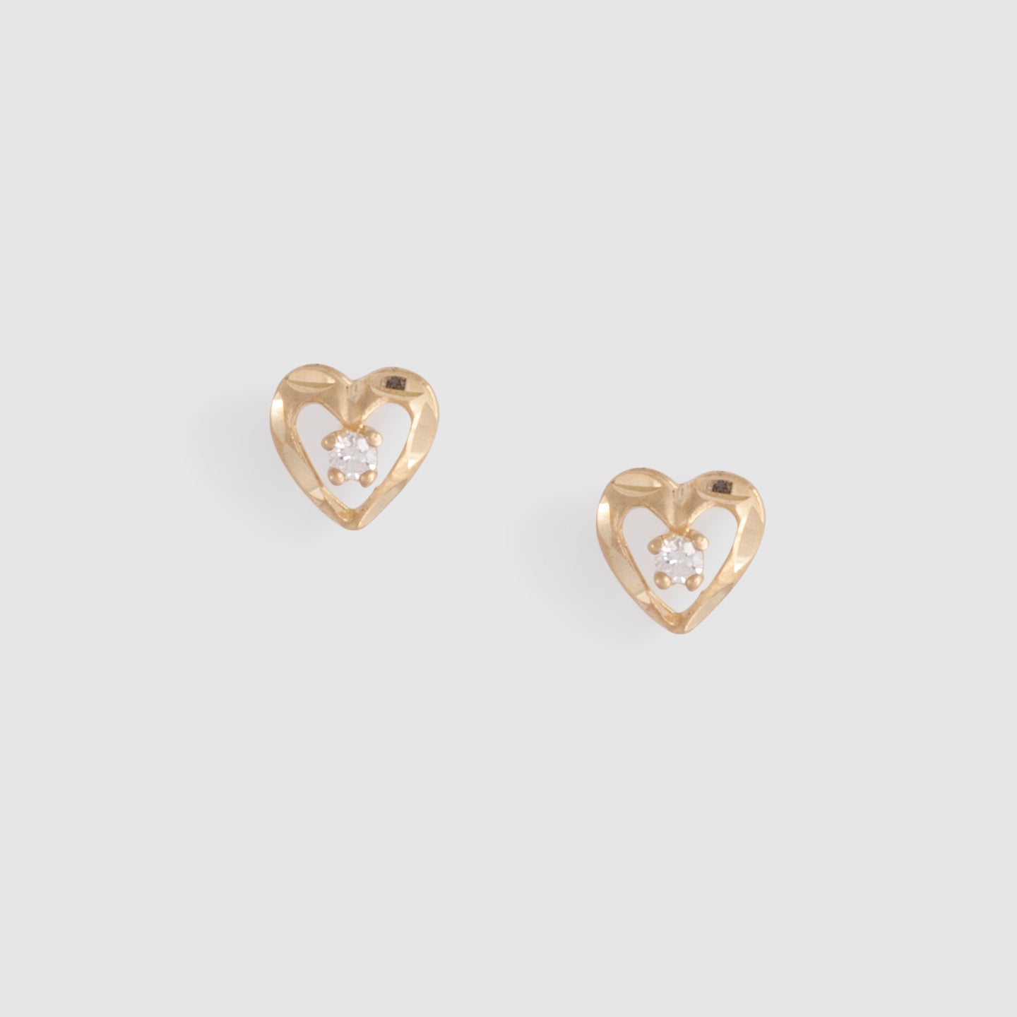 Gold heart-shaped studs with cz stone