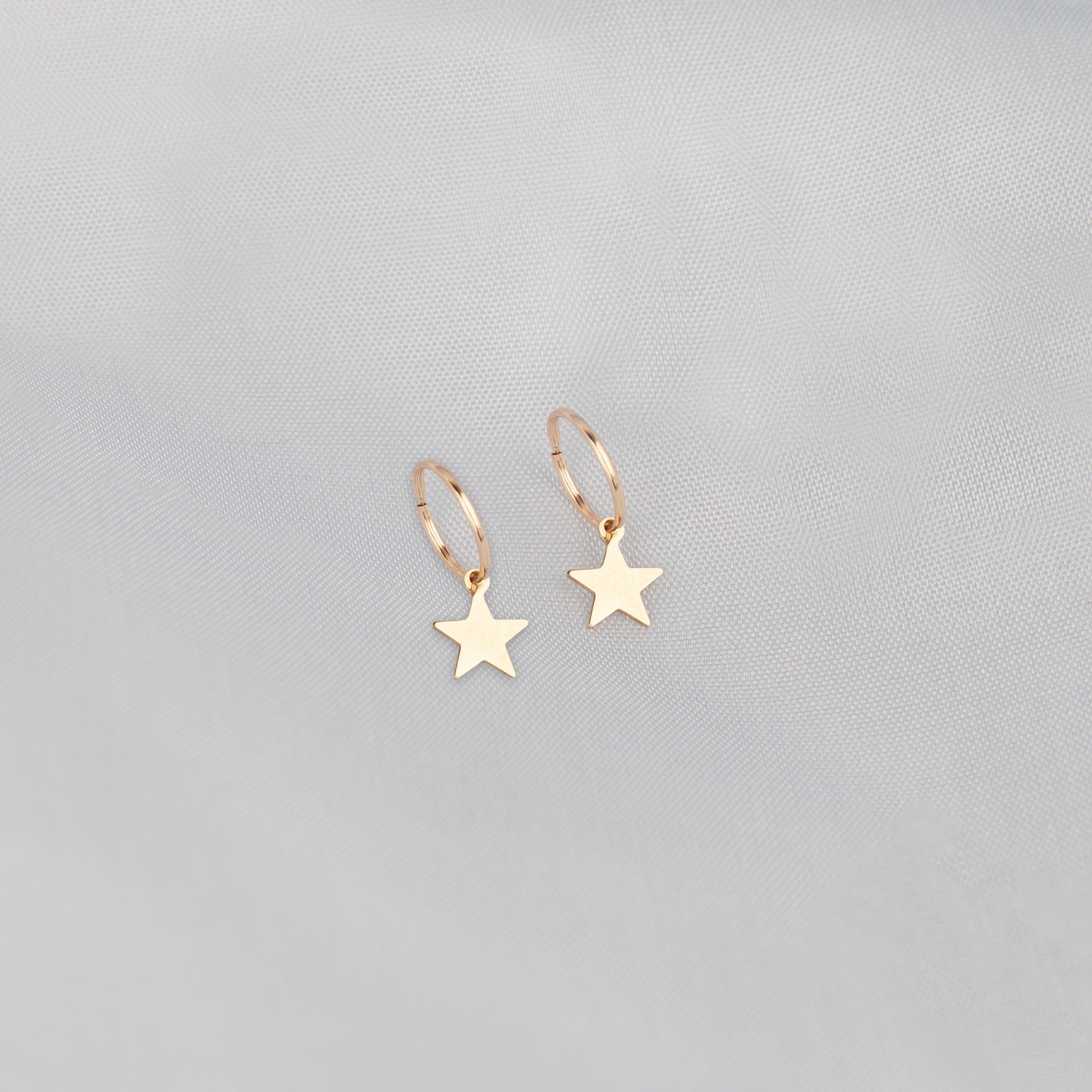 small infinity hoops with stars in 10k gold