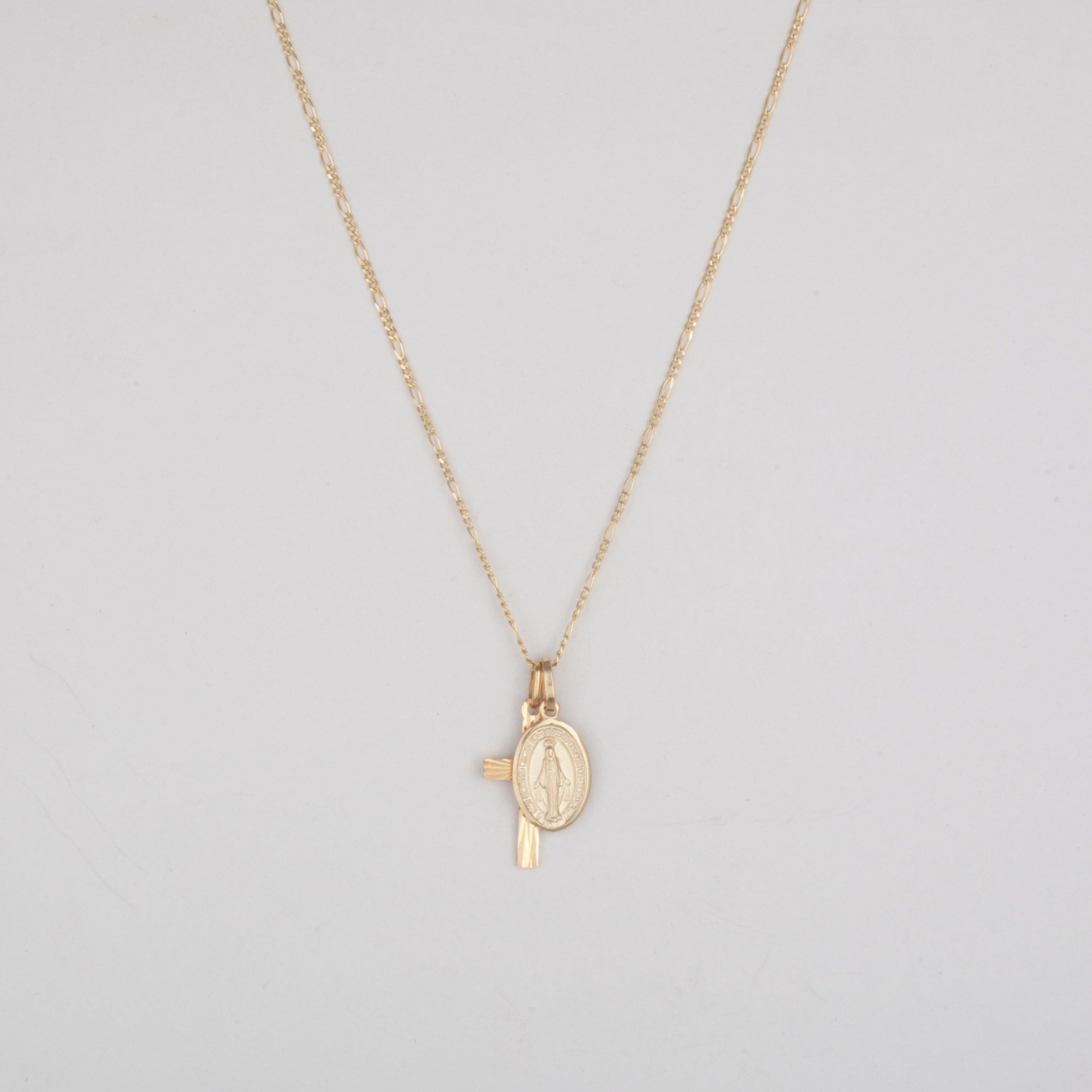 10k gold cross and mary pendant on a thin figaro chain