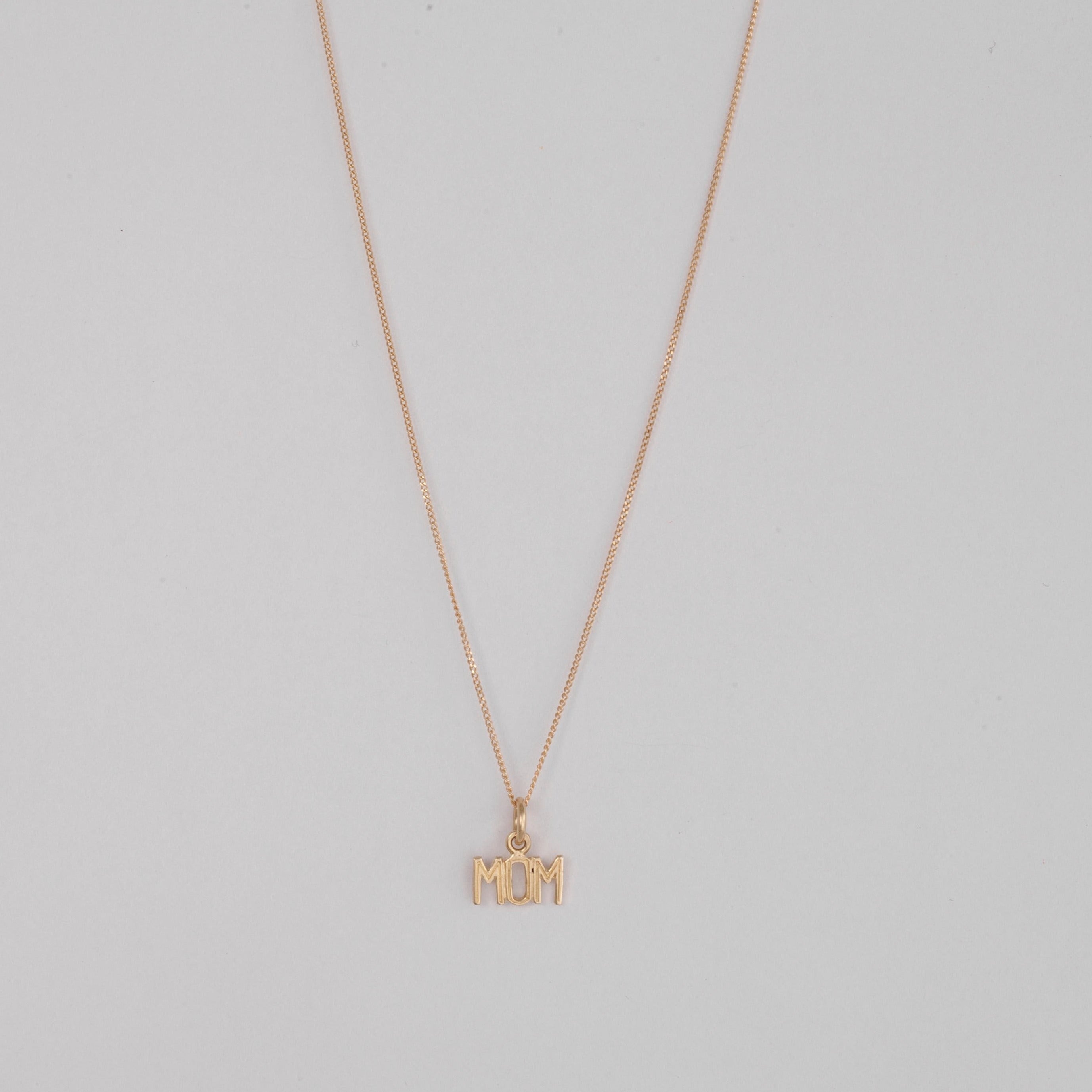 10k Gold MOM pendant on a thin curb chain