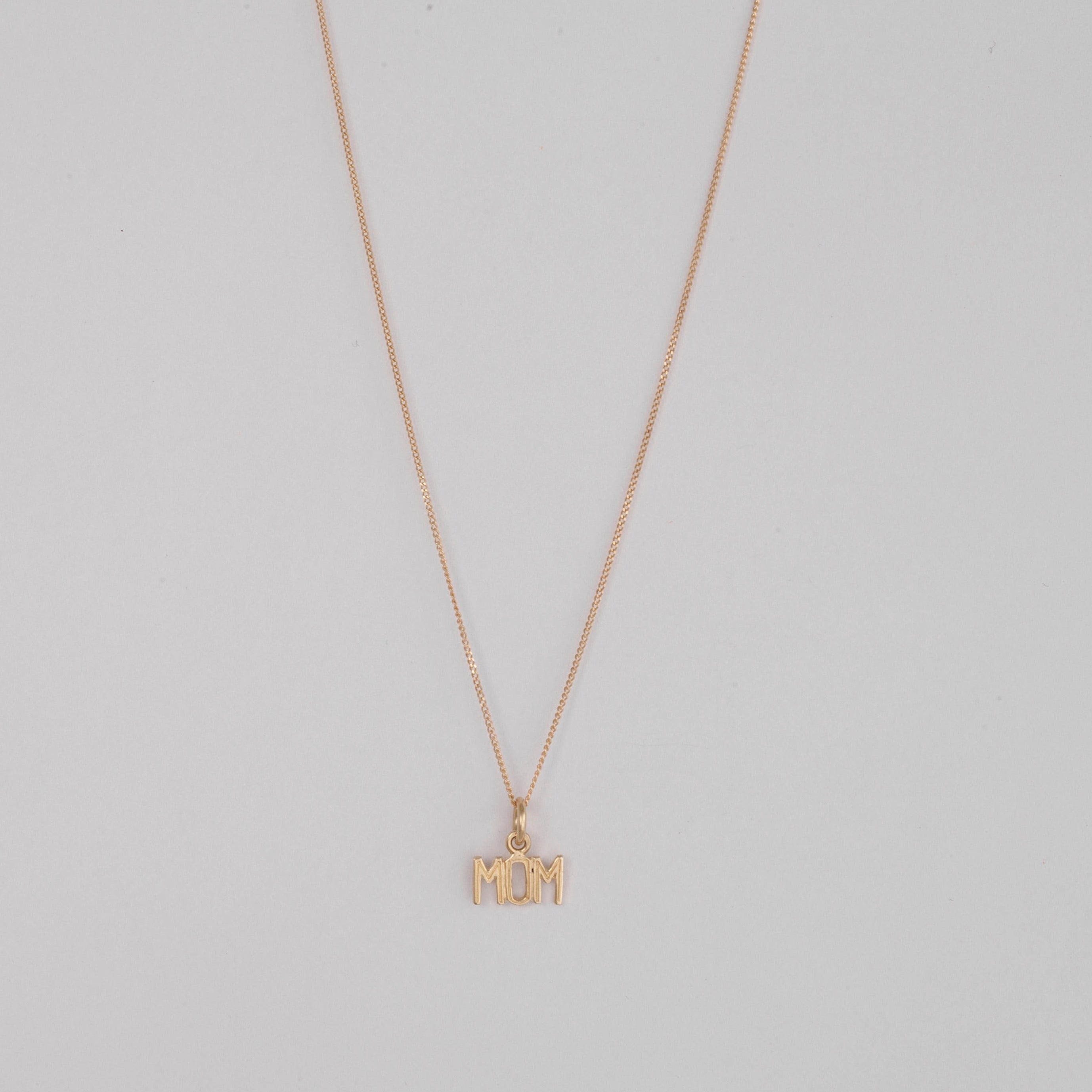 10k Gold MOM pendant on a thin curb chain
