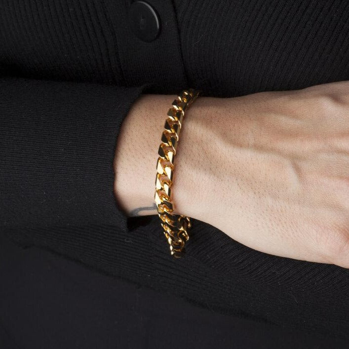 model wearing gold cuban link bracelet