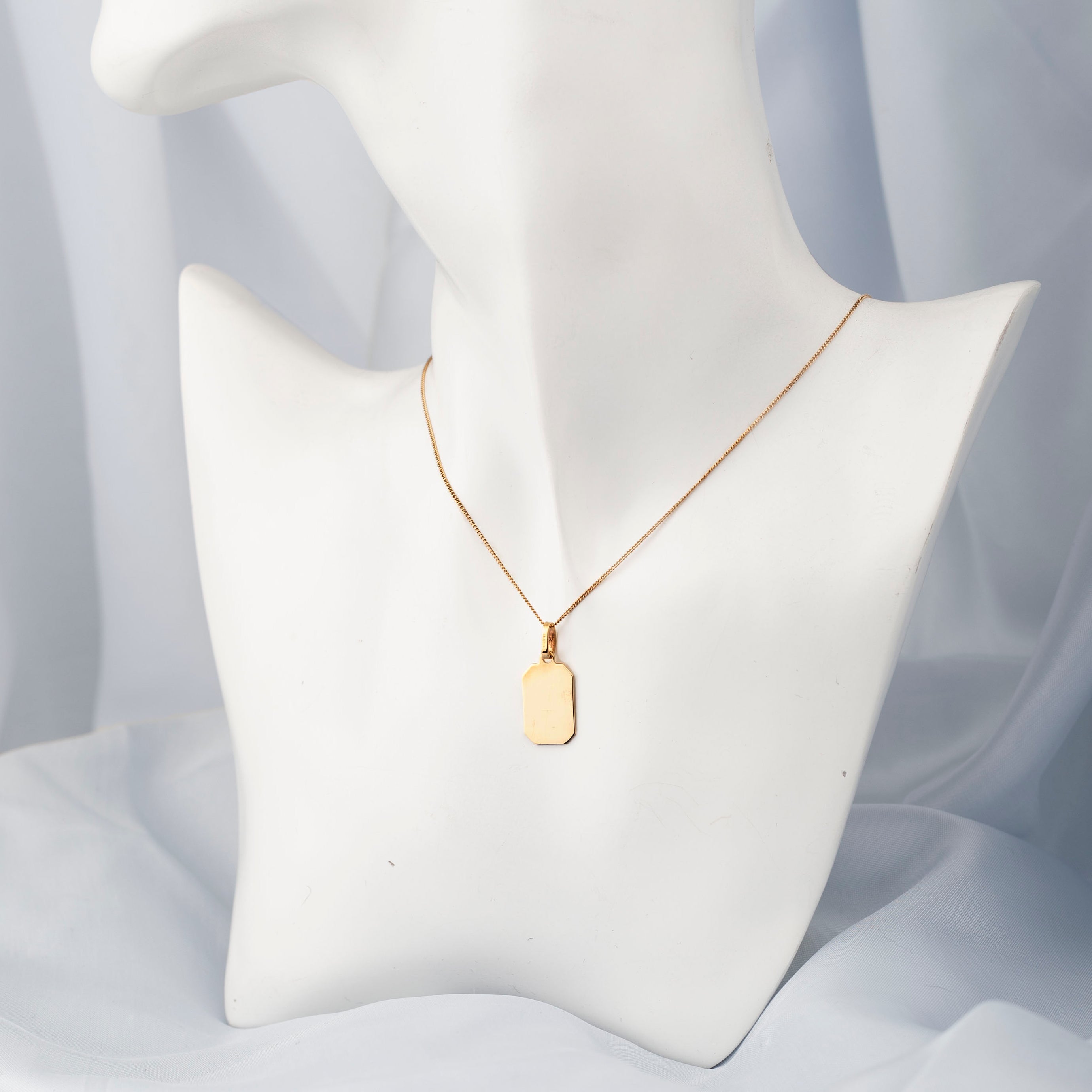 Rectangle Pendant with cut corners in10k gold with a thin gold curb chain