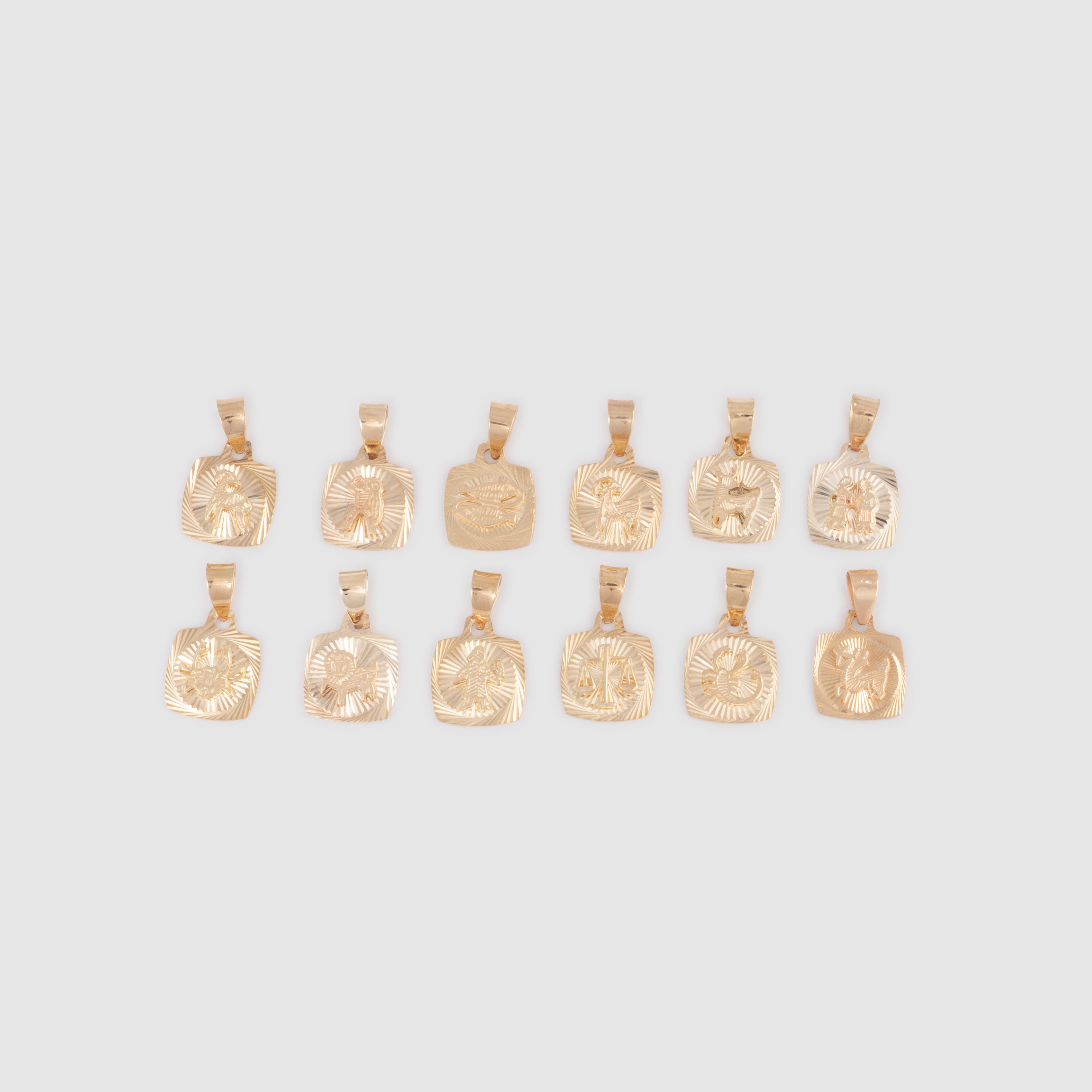 Gold square shaped zodiac pendants with diamond cut details