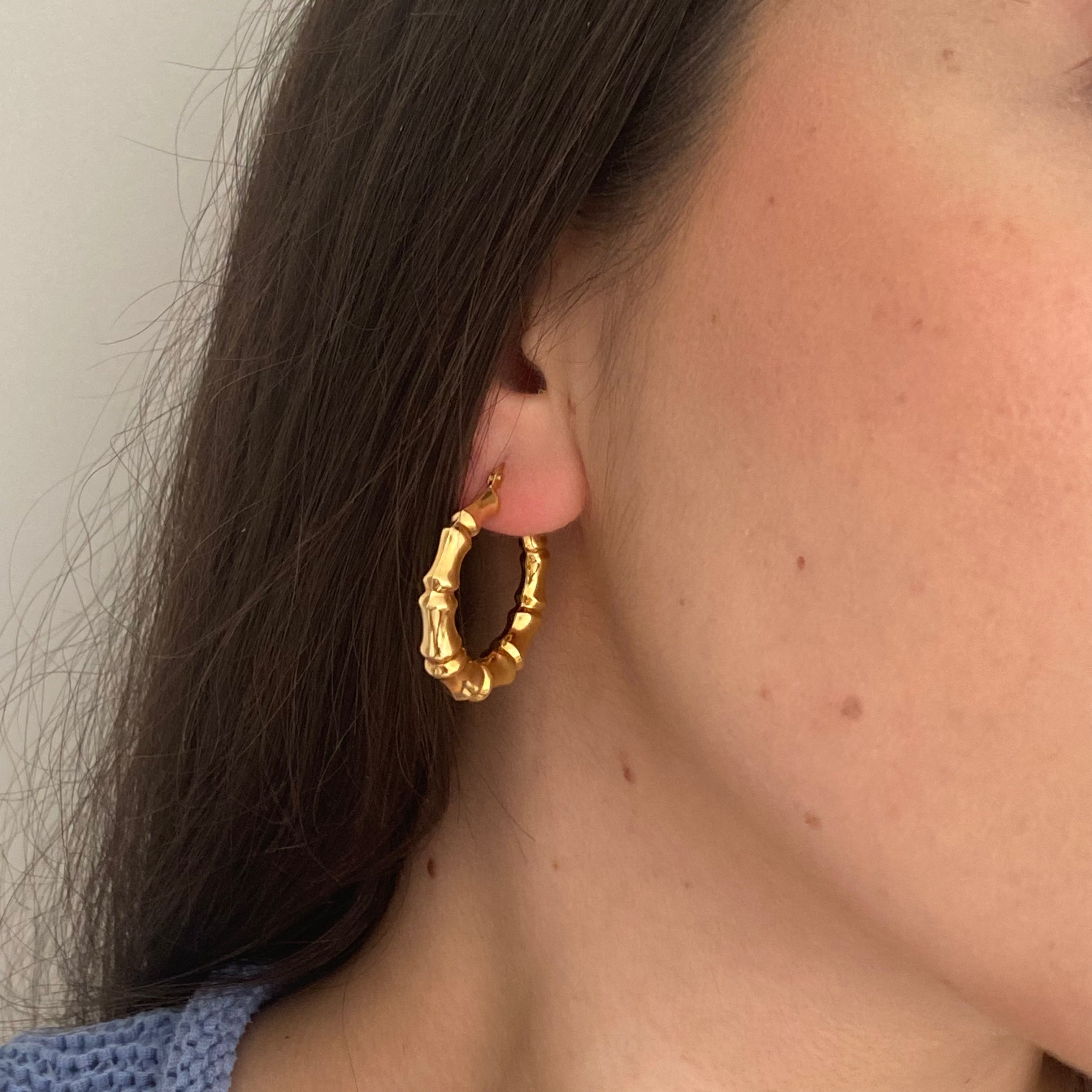 14K gold bamboo detail hoops on figure