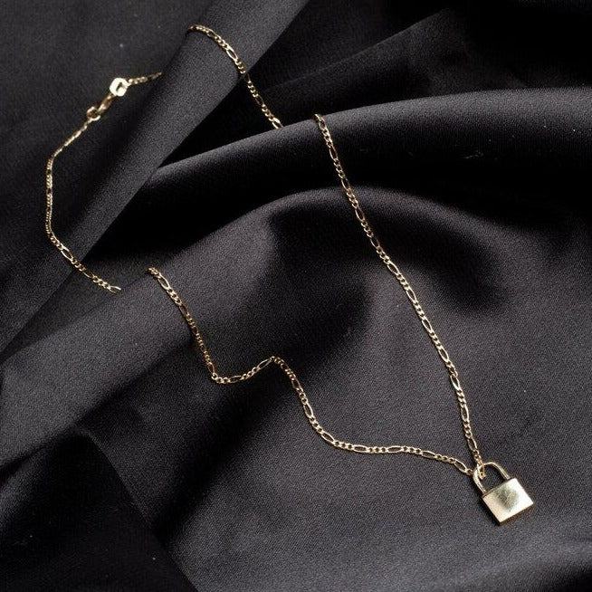 10k gold LOCK PENDANT NECKLACE with a thin figaro chain